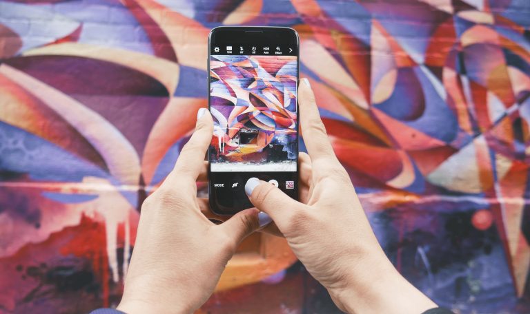 image of street art on a smart phone