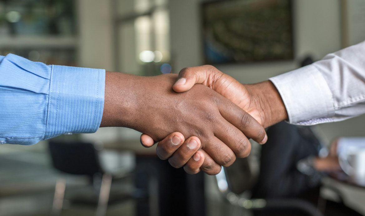 A handshake between two people doing business