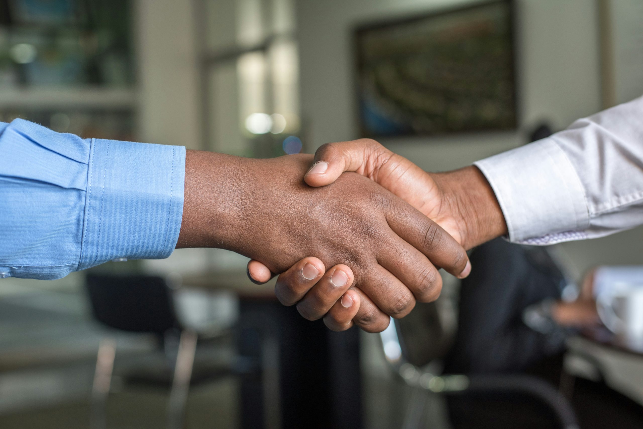 A handshake between two people doing business