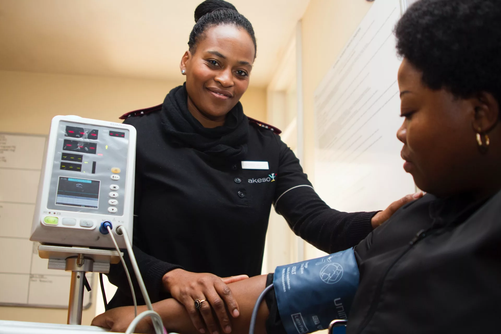 Healthcare practitioner taking someone's blood pressure