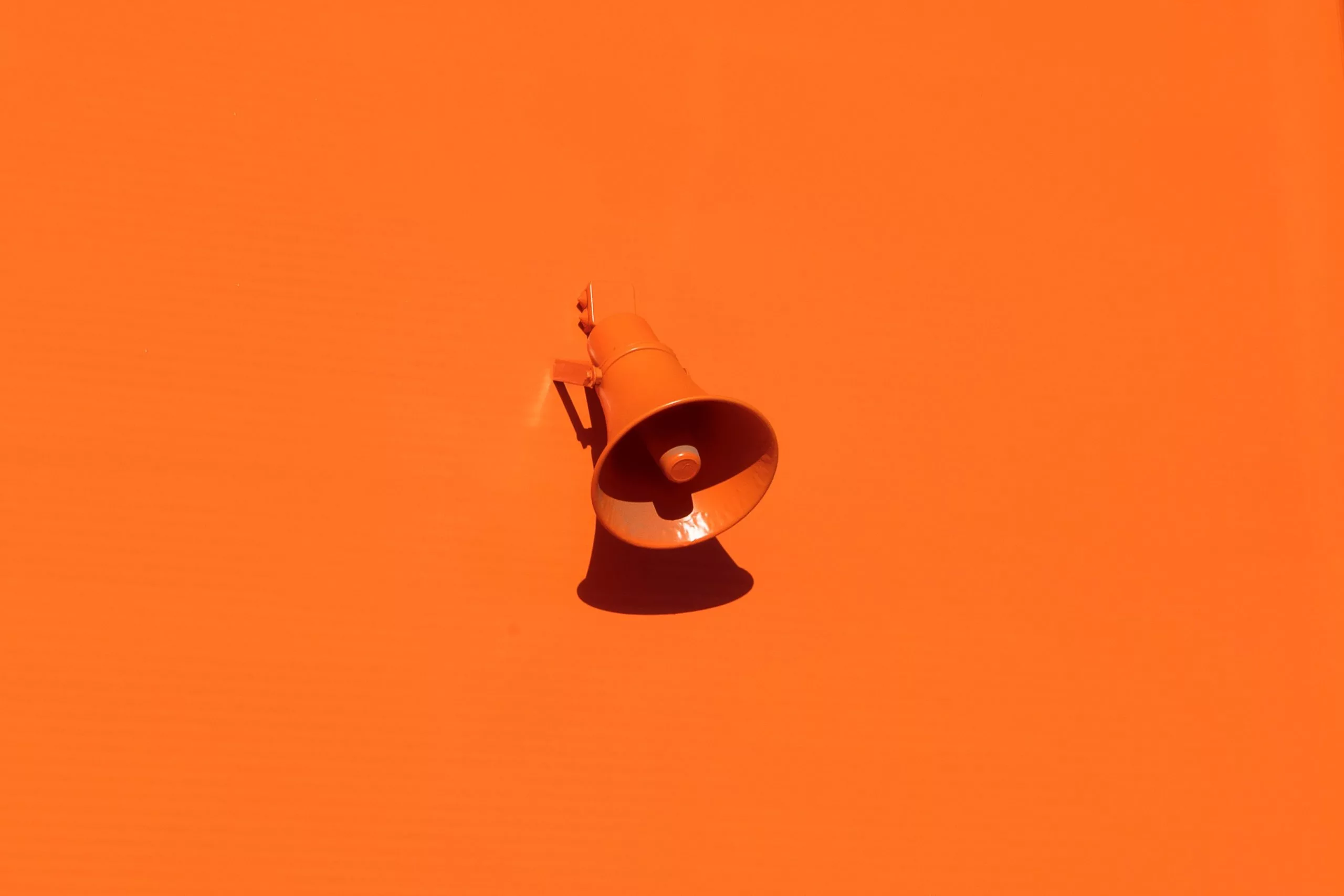 orange microphone against orange background