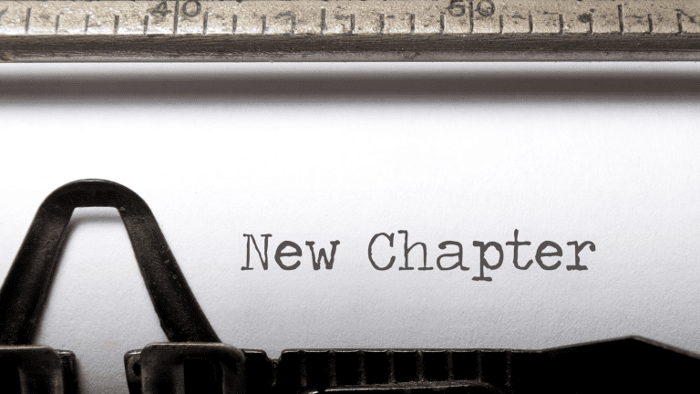 Paper in typewriter reading 'New Chapter'