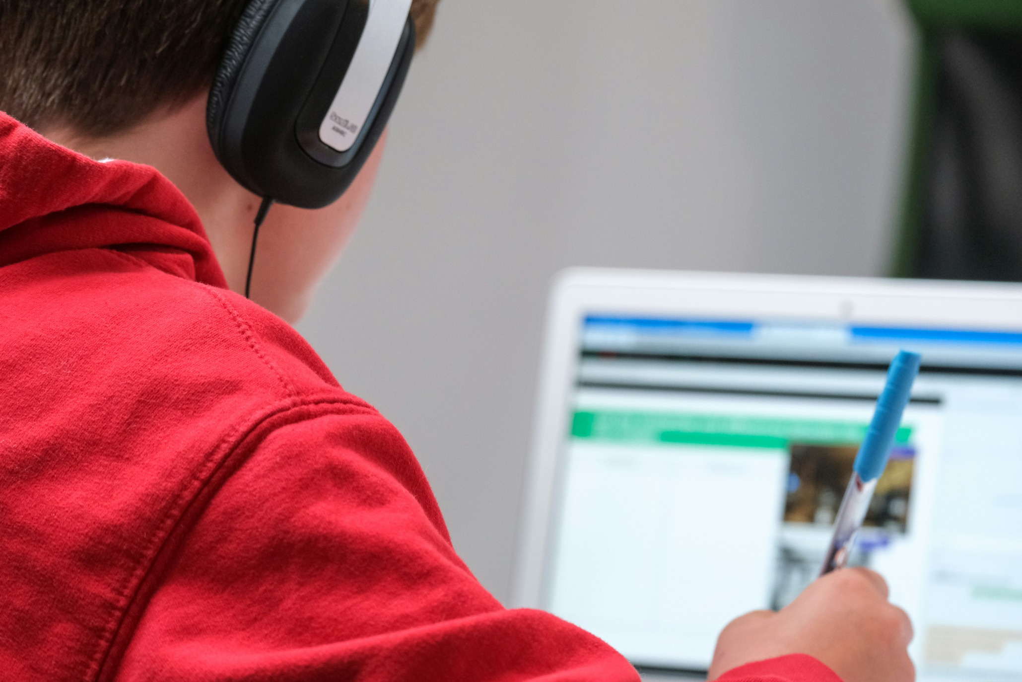 Student on laptop with headphones