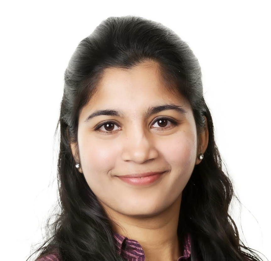 woman smiling with dark wavy hair on a white background